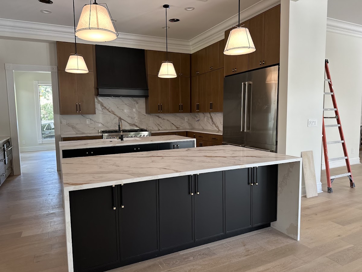 Kitchen cabinetry · Installation in progress: Warm wood, dark accents.